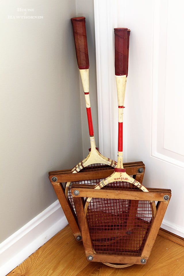 Vintage badminton racuets in an eclectic vintage entryway via houseofhawthornes.com