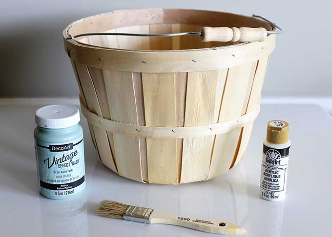 Repurposing bushel basket into outdoor planter.