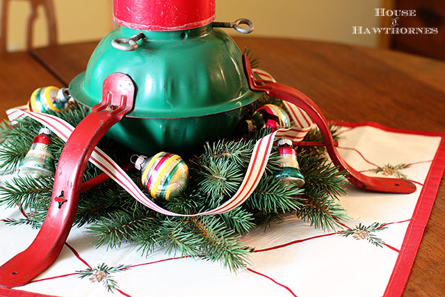 Super cute holiday candle holder repurposed from a Christmas tree stand. What a great DIY upcycle project for the holidays!