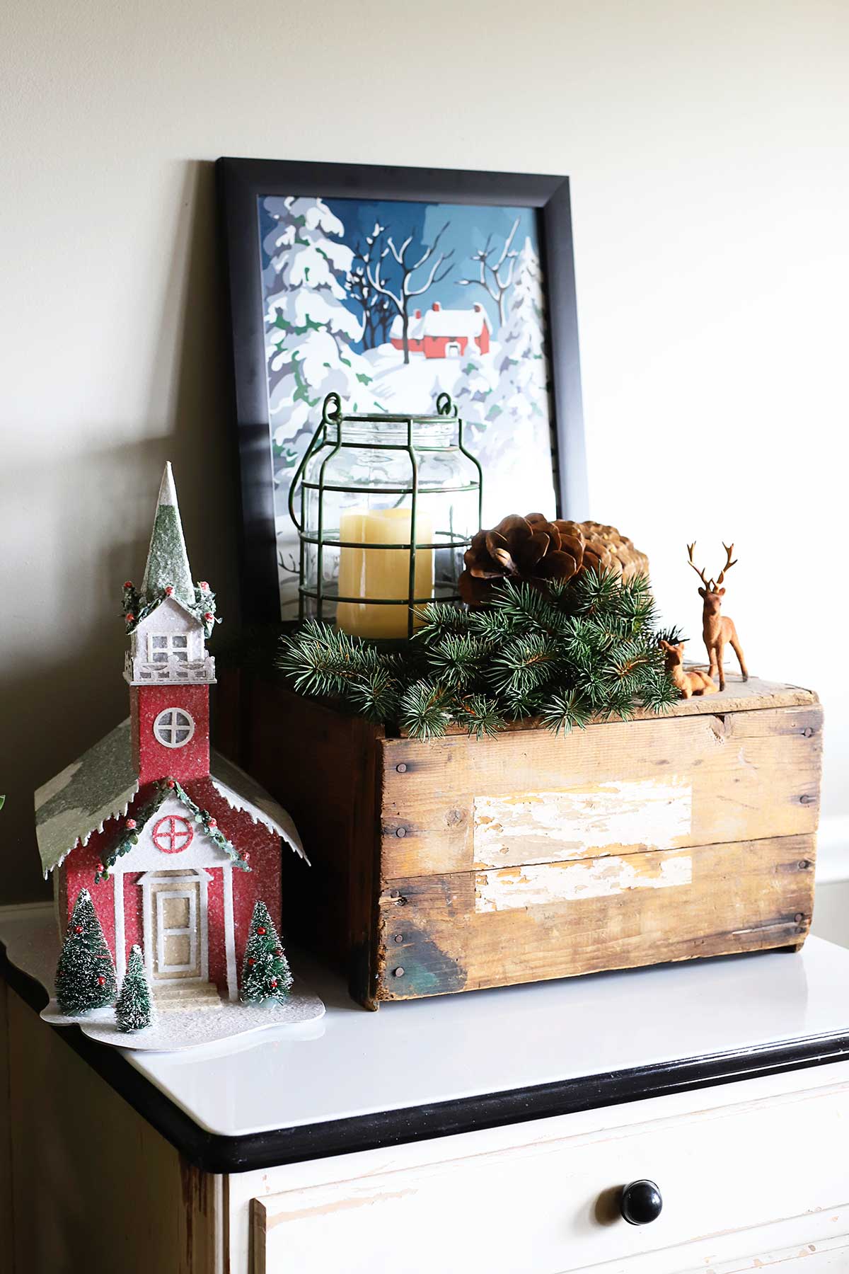 vignette in the kitchen dining room with paint by number print and cardboard church