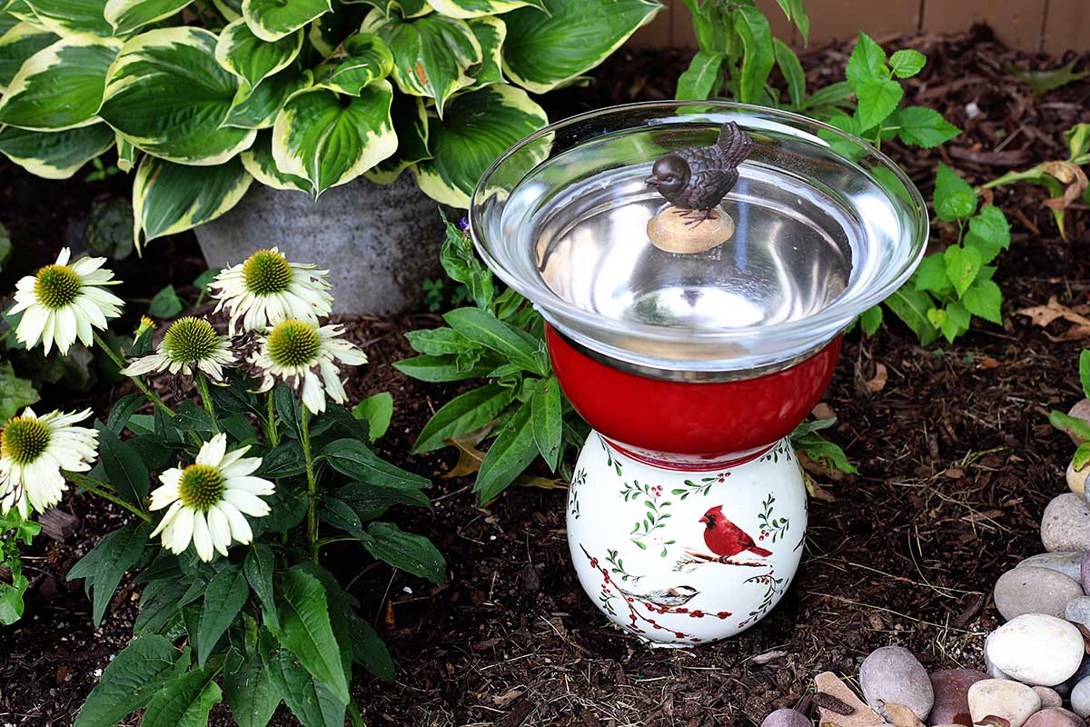 Repurposed bird bath setting in the garden.