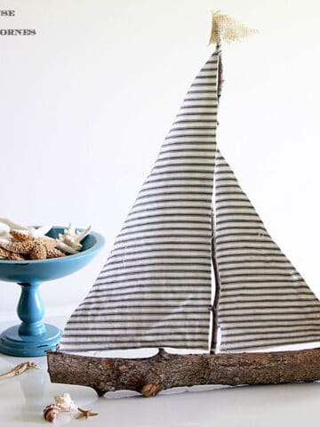 Sailboat made from twigs and scrap fabric.