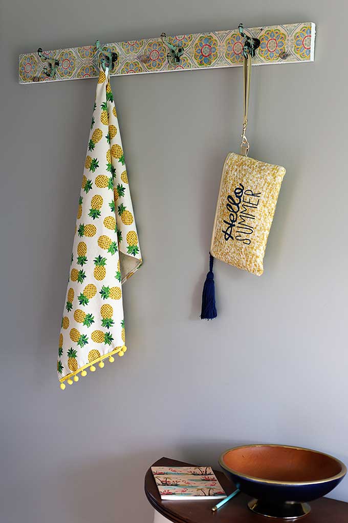 Boho style wall mounted coat rack with vintage hooks. 