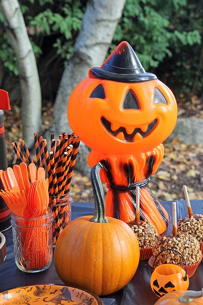 Jack-O-Lantern and cornstalk Empire Plastic blow mold from the 1960's at a traditional Halloween party with orange and black decor including blow molds and vintage inspired Halloween decorations.