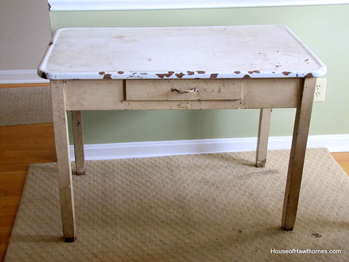 A vintage enamel topped baking table used for rolling out pie crust and cutting out biscuits and cookies.  A workhorse of the 20th century kitchen!  