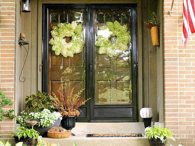 Limelight Hydrangea wreaths on a fall porch from Hearth And Vine