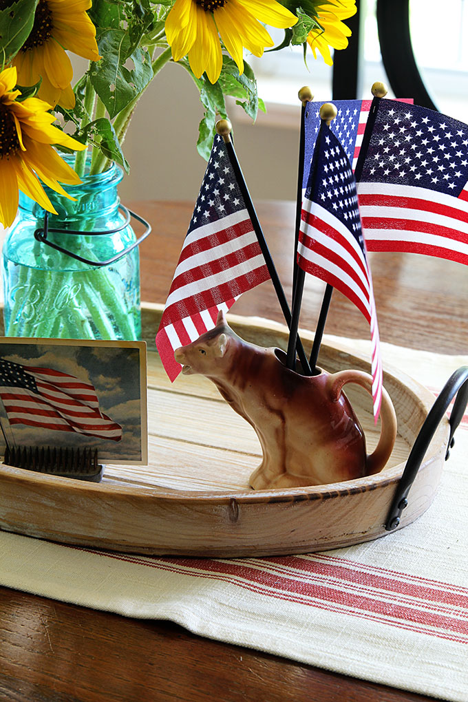 Cow creamer used in patriotic centerpiece