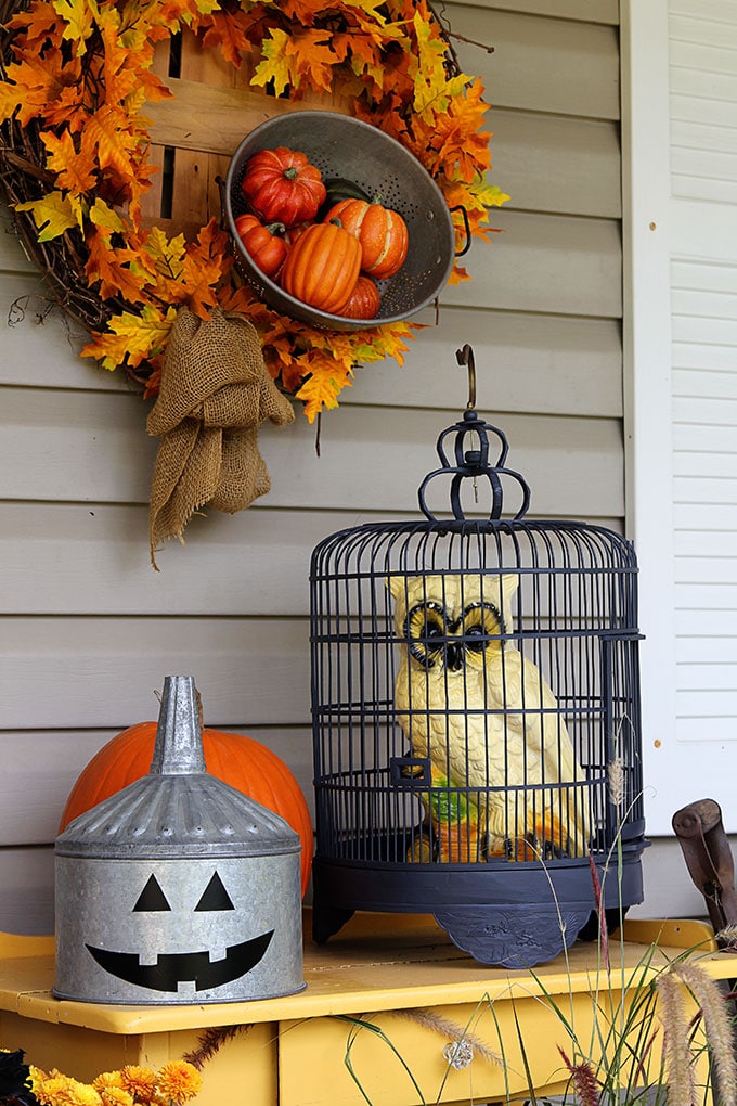 Quick and easy Halloween decorating ideas for your porch. An inexpensive way to transition the porch from fall to Halloween decor with just a few additions. 