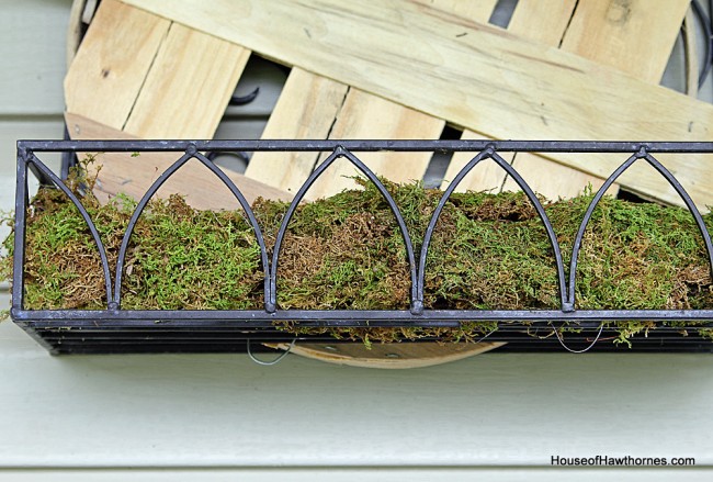 DIY tutorial to make a fall planter box with natural elements found at craft stores. A great alternative to a traditional fall wreath for your front door!