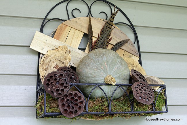 DIY tutorial to make a fall planter box with natural elements found at craft stores. A great alternative to a traditional fall wreath for your front door!