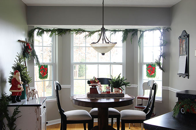 This nostalgic Christmas breakfast room is a great example of how to use vintage Christmas decor in your home without it looking like your grandma's house!