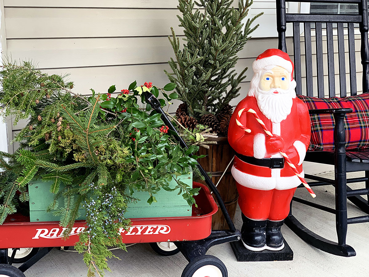 Close up of Radio Flyer red wagon and retro Santa blow mold.