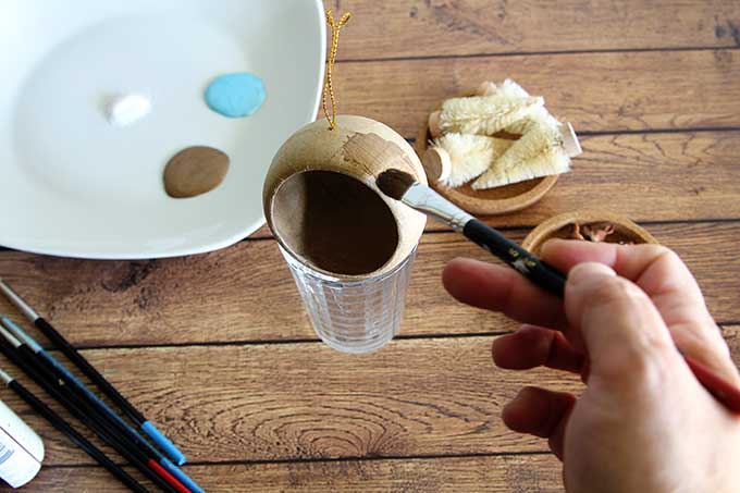 Painting paper mache Christmas ornaments