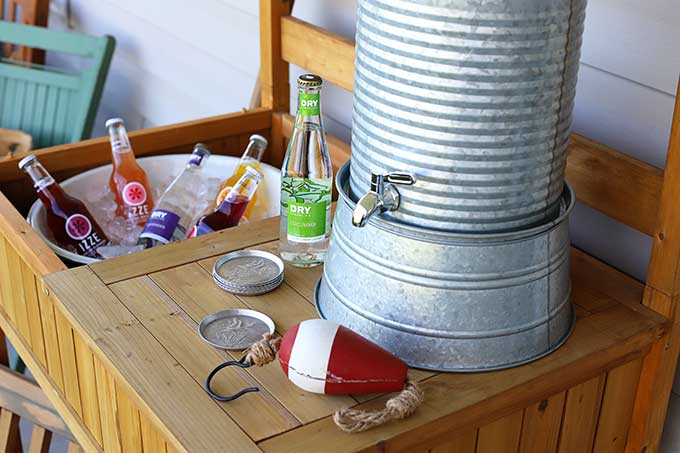 Outdoor potting bench used as a serving station for summer entertaining