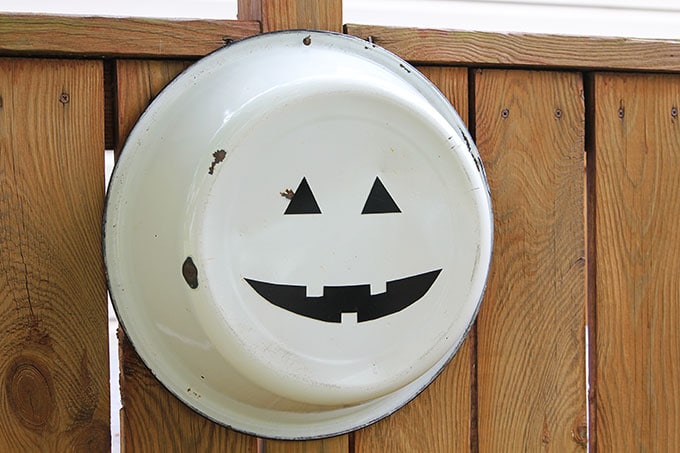 A super cute repurposed Jack-o-Lantern for Halloween made from a galvanized funnel. A quick and easy DIY project for fall!