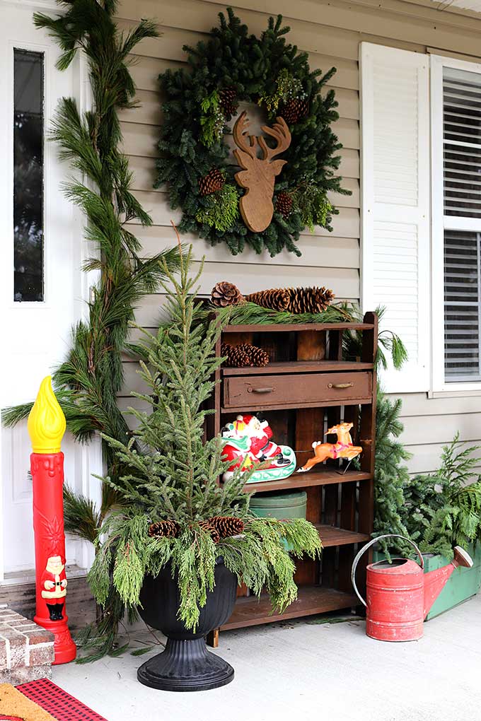 Vintage blowmold candles used as Christmas porch decor