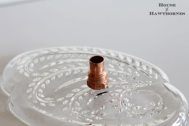 Vintage glass snack set repurposed into a bird feeder