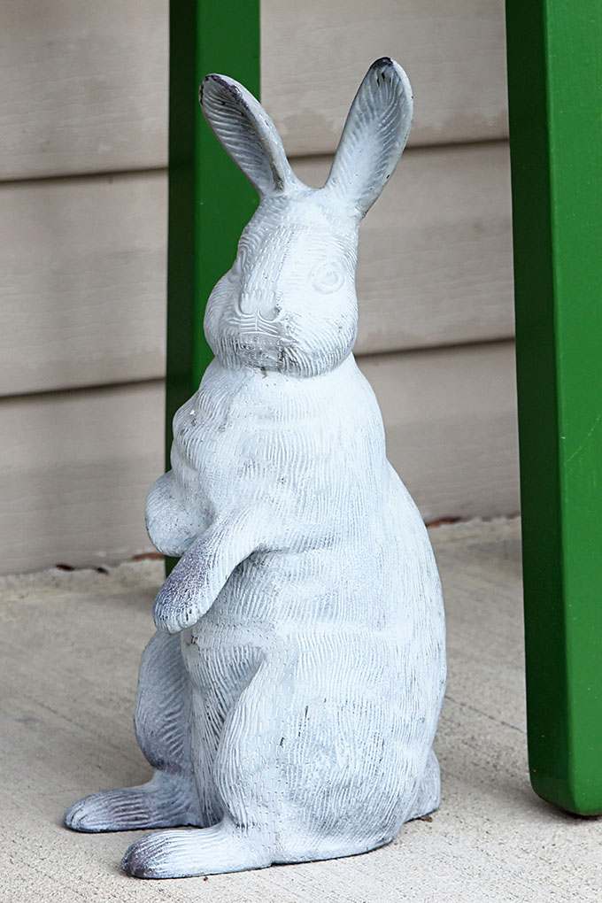 Concrete bunny used on a spring front porch