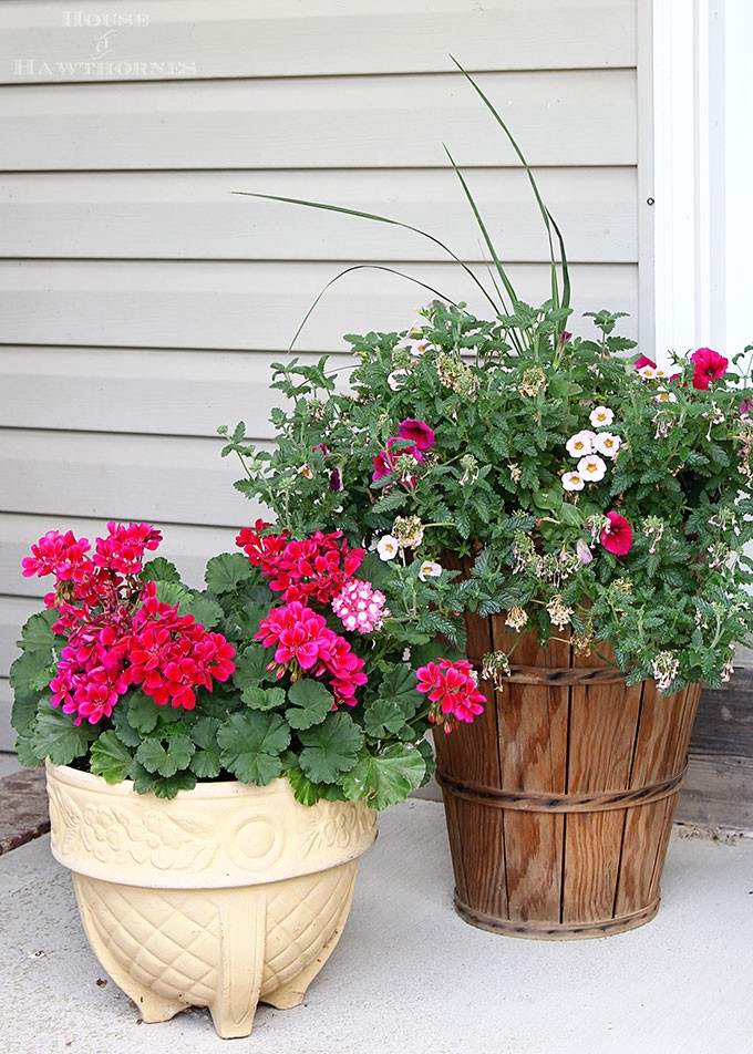 Summer porch decorating ideas and inspiration using farmhouse touches, vintage items, plenty of annual flowers and a healthy dose of patriotic decor.