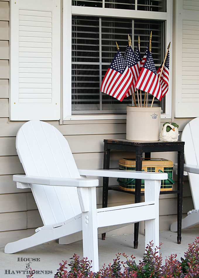 Summer porch decorating ideas and inspiration using farmhouse touches, vintage items, plenty of annual flowers and a healthy dose of patriotic decor. 