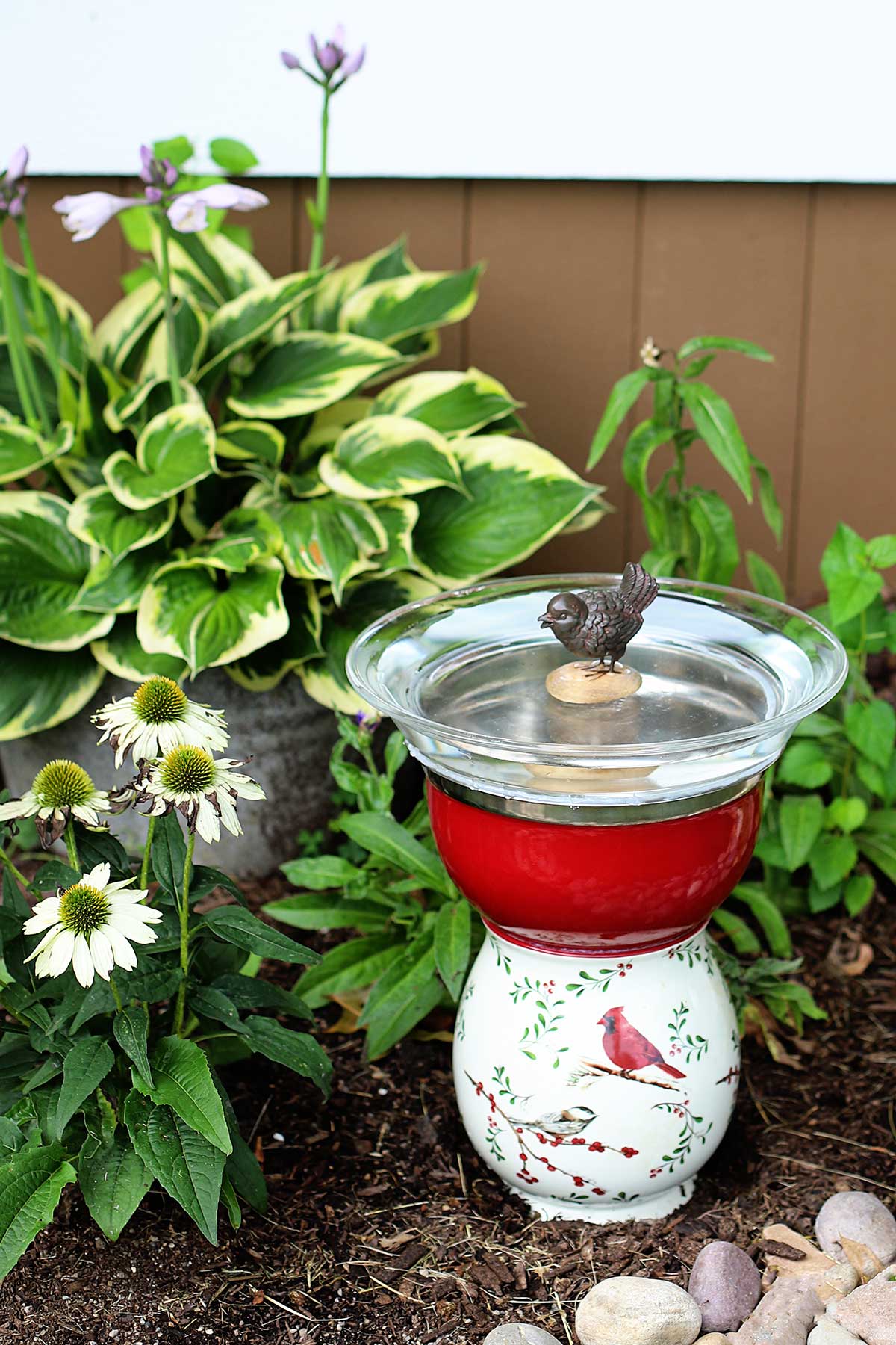 Upcycled thrift store glassware made into a bird bath for the garden.