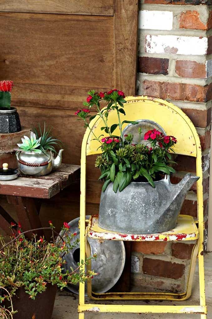 Upcycled tea kettle into a flower pot