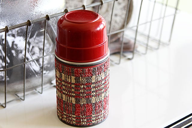 Vintage plaid Aladdin thermos with a cork stopper