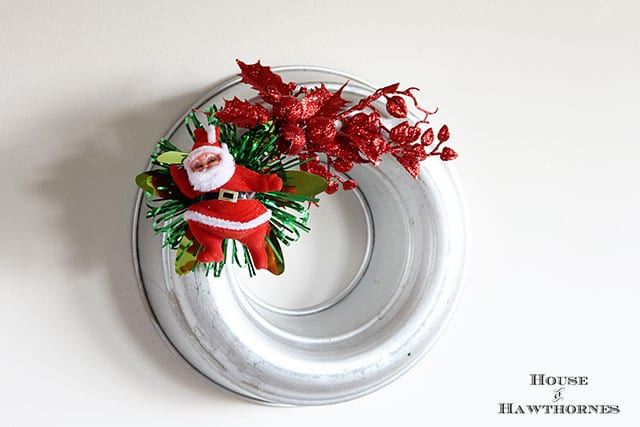 Kitschy vintage styled Christmas wreaths made from jello molds and faux vintage corsages. Sort of like the Christmas corsages your Grandma used to wear to church on Christmas Eve.