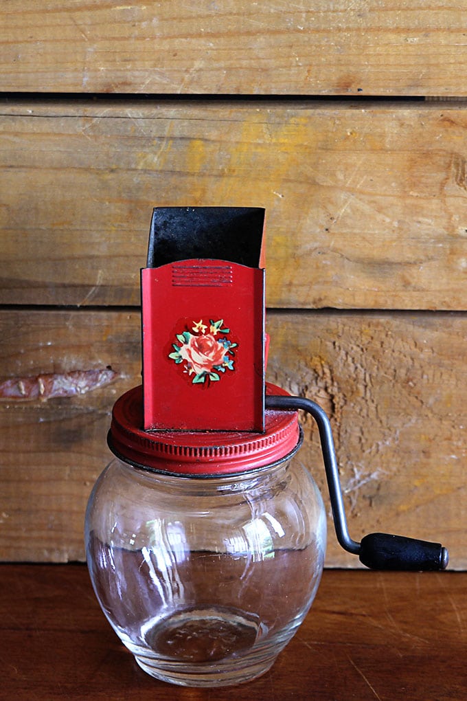 Vintage nut grinder with retro graphics found at a yard sale