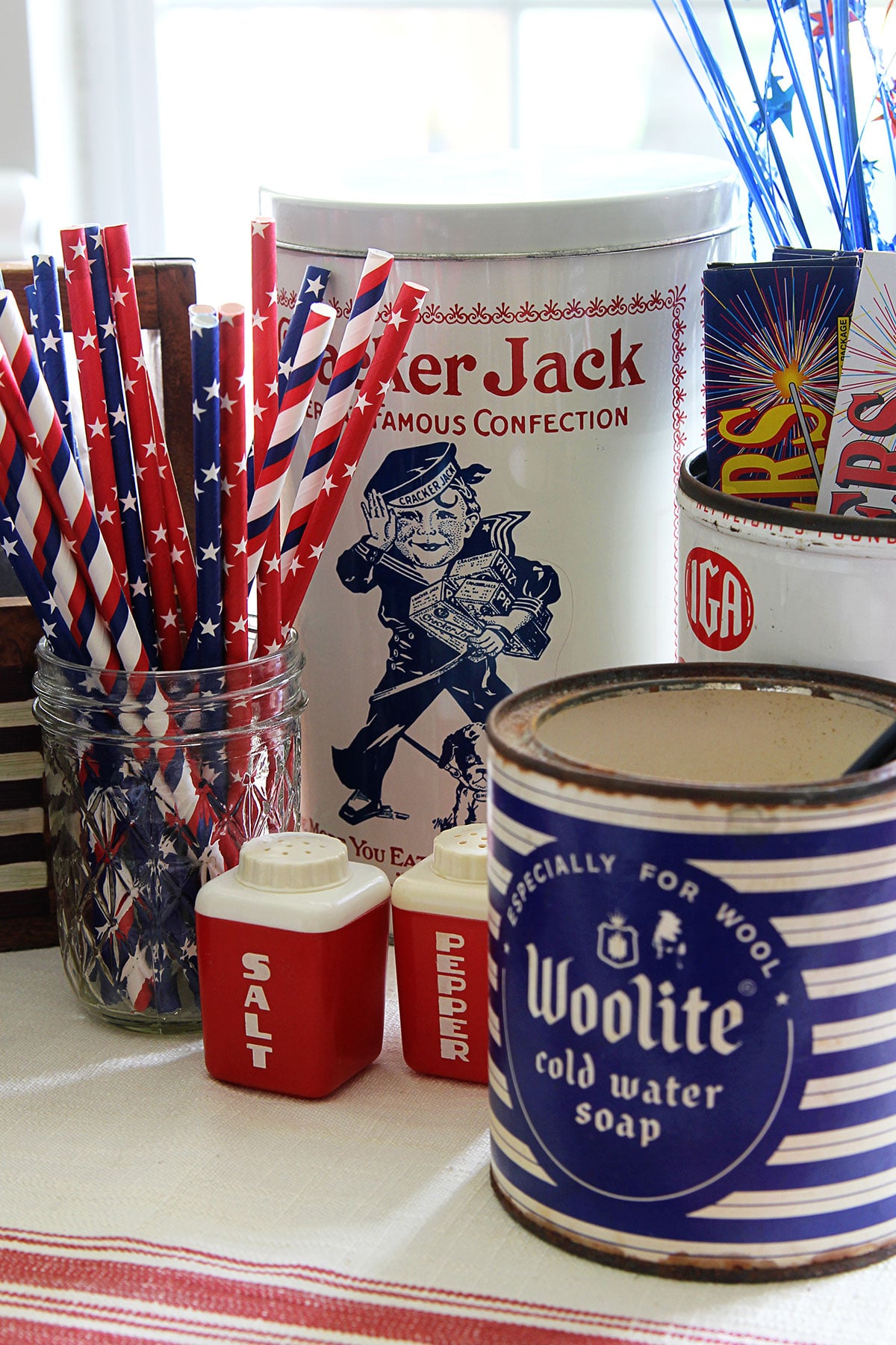 A patriotic vignette with a mix of red white and blue vintage items for the 4th of July