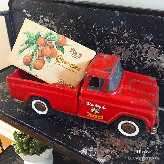 Vintage box of chocolate covered cherries in a toy Buddy L truck