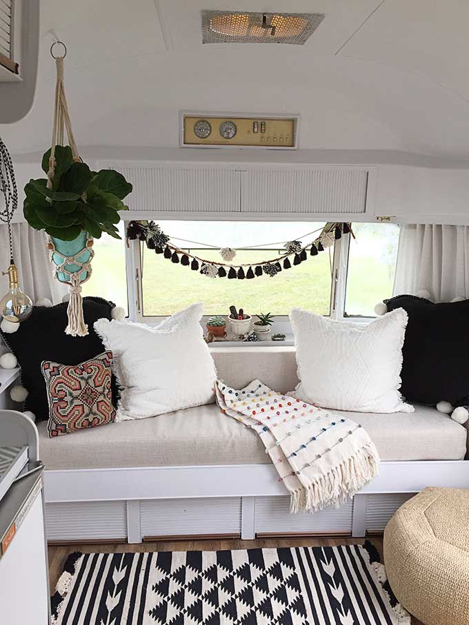 Interior of vintage boho Airstream trailer.