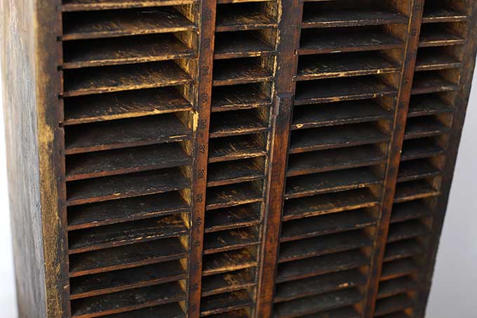 Numbers on wooden crate with dividers - possibly a letterpress cabinet