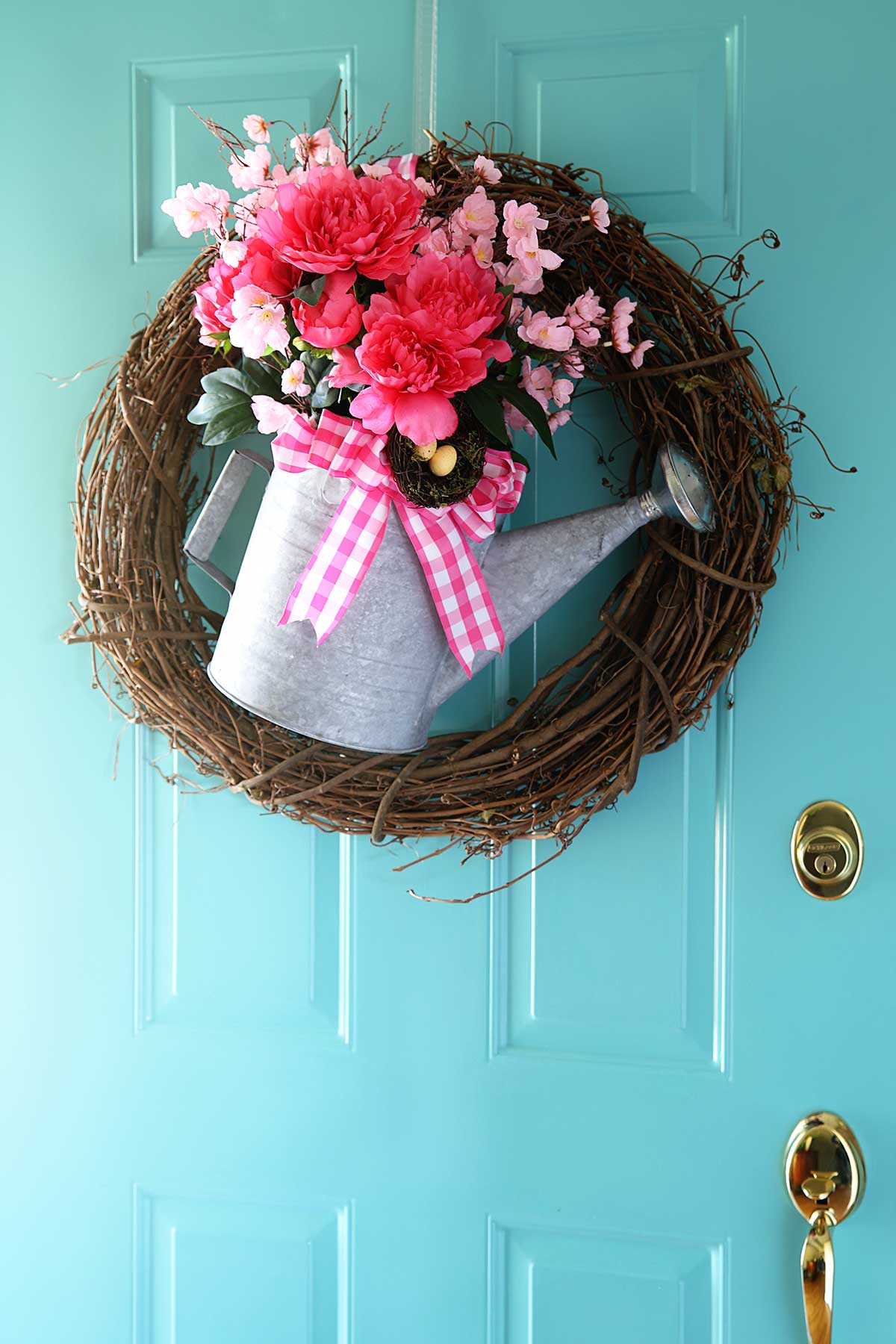 repurposed watering can spring wreath