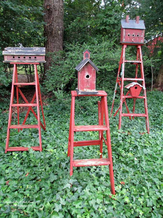 Use a wooden ladder as garden art in the flower beds this summer. They add much needed height to the garden and a place to display bird houses and planters.